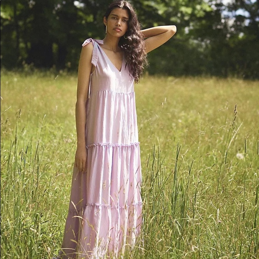 A sweetly tiered silhouette and a hint of shimmer make this dress a favorite